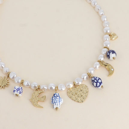 Collier sur fil - coeurs, soleil, oiseau, lune, perles en céramique émaillée