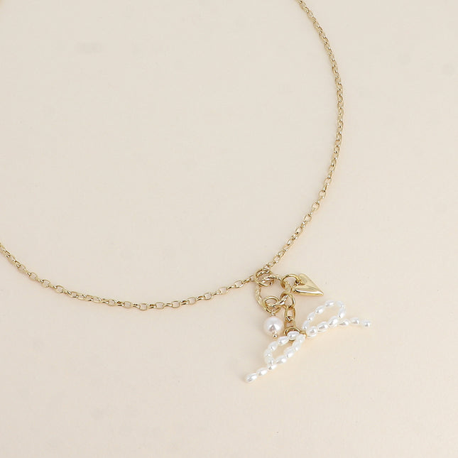 Necklace - bow tie with white resin beads, heart