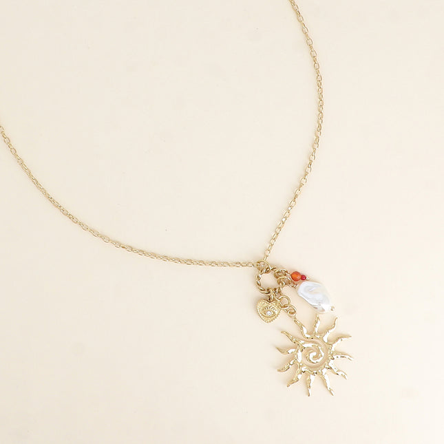 Collier - soleil, perle de résine blanche, coeur et oeil