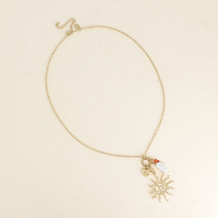 Collier - soleil, perle de résine blanche, coeur et oeil