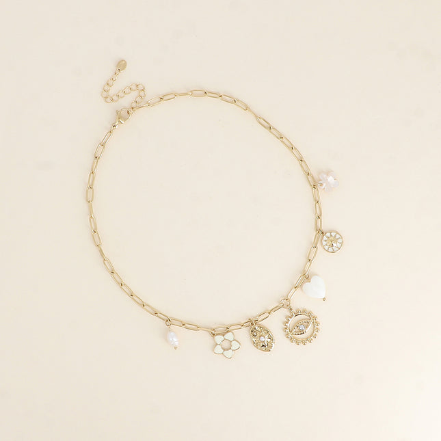 Collier - fleur en émail, soleils, coeur nacré, oeil, perle d'eau douce