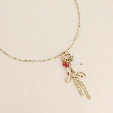 Collier - anneau torsadé, noeud papillon, coeur et pierres naturelles
