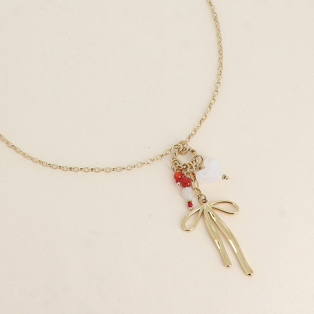 Necklace - twisted ring, bow tie, heart and natural stones