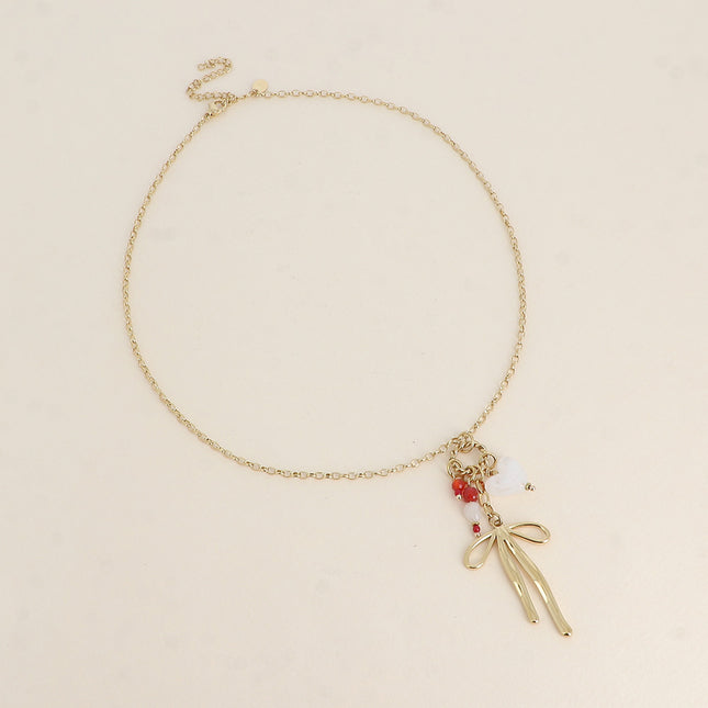 Necklace - twisted ring, bow tie, heart and natural stones