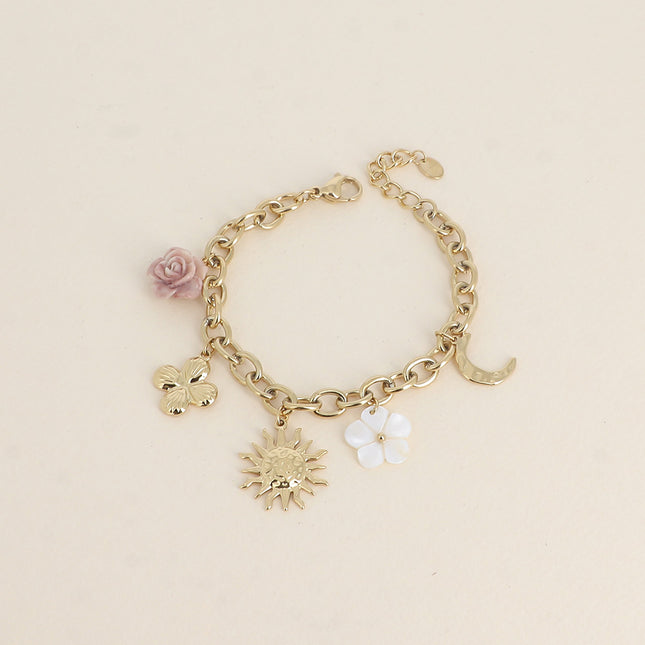 Bracelet - fleur en résine, fleur nacrée, soleil, lune et trèfle