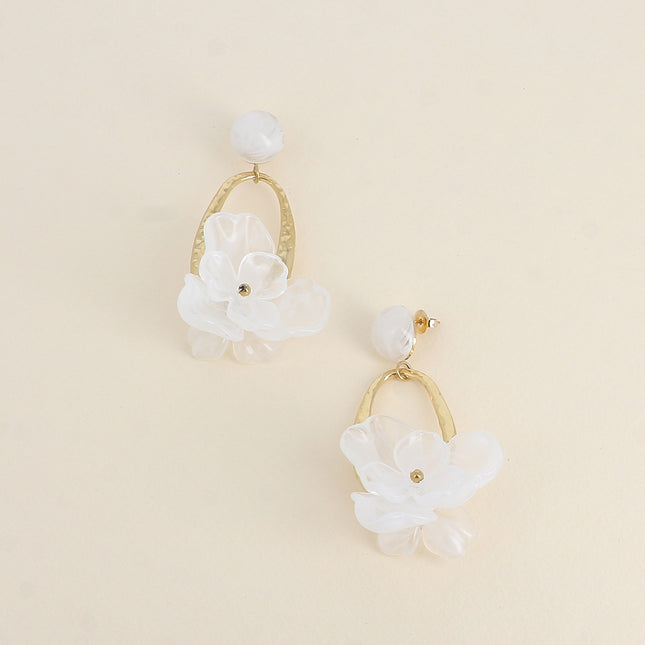 Dangle earrings - stud earrings with a half-sphere of resin, a hammered openwork oval piece, and colored resin in the shape of foliage