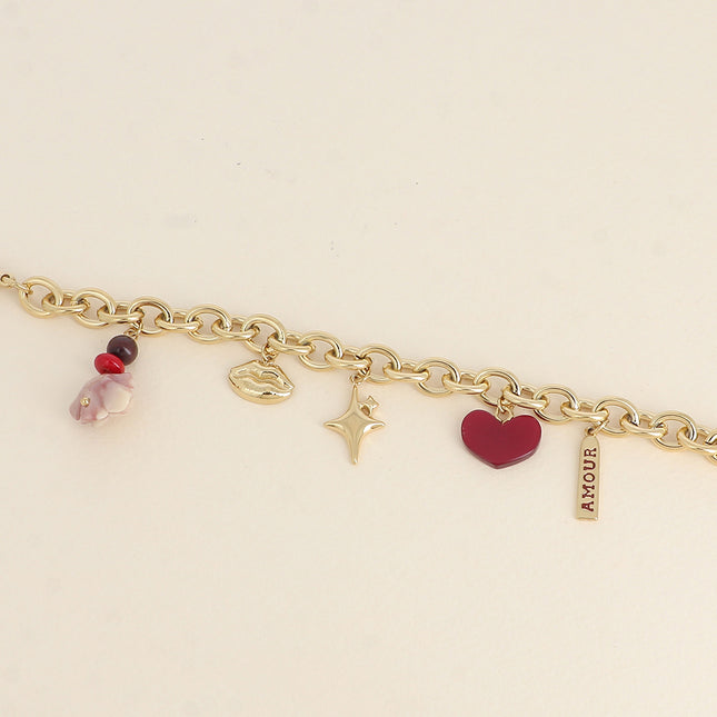 Bracelet - pendentifs (bouche, étoiles, rose et coeur en résine, perles, plaquette AMOUR)