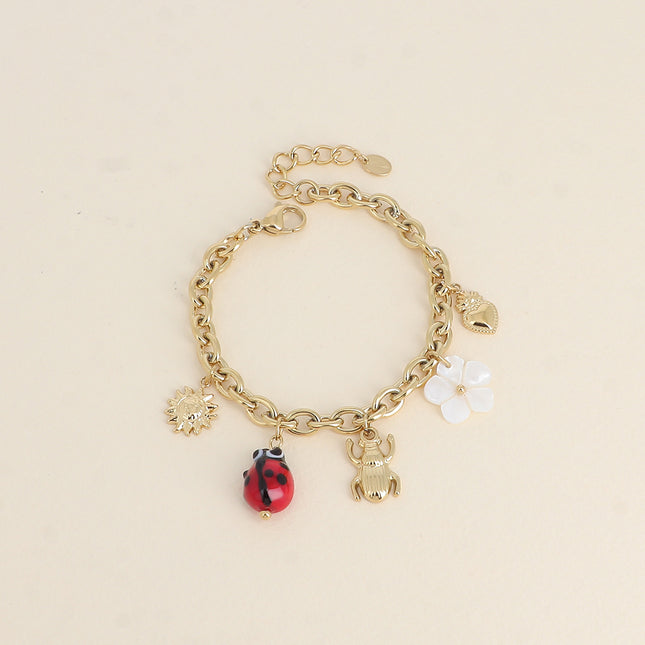 Bracelet - pendants (sun, glazed ceramic ladybug, beetle, mother-of-pearl flower, heart)