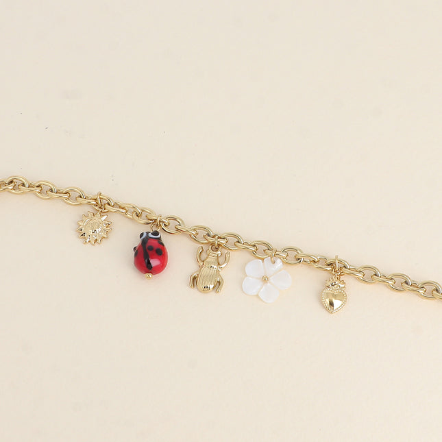 Bracelet - pendants (sun, glazed ceramic ladybug, beetle, mother-of-pearl flower, heart)
