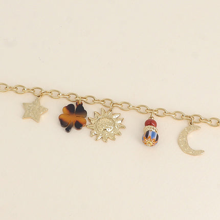 Bracelet - pendentifs (soleil, étoile et lune martelés, trèfle en résine léopard et perles)