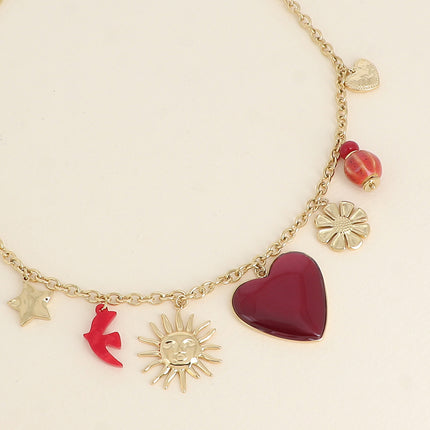 Collier Lior - pendentifs (étoile, soleil, oiseau en résine, coeur en émail, fleur, perles, coeur)