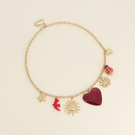 Collier Lior - pendentifs (étoile, soleil, oiseau en résine, coeur en émail, fleur, perles, coeur)