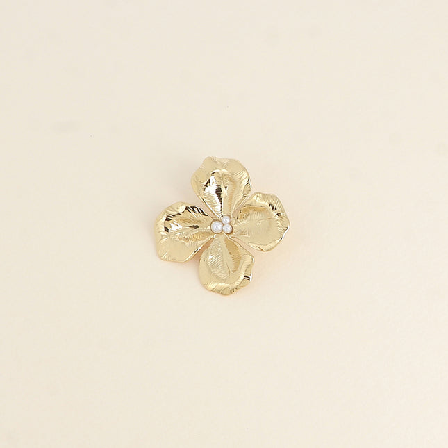 Pin's Aube - motif fleur texturé avec petites perles de résine blanche