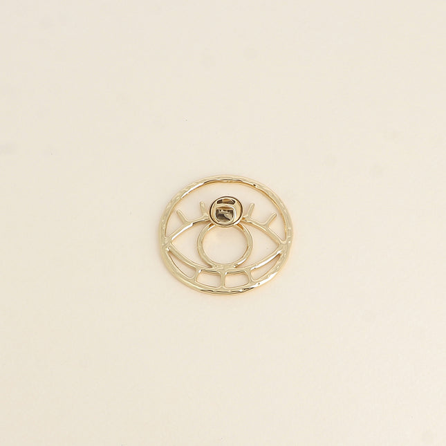 Pin's - motif oeil ajouré