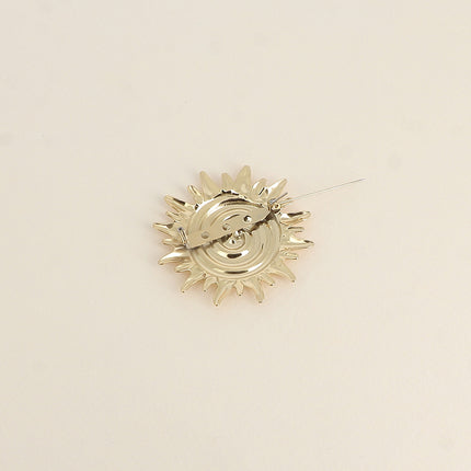 Brooch - sun motif