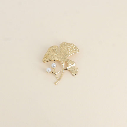Avelia brooch - ginkgo motif with two white resin beads