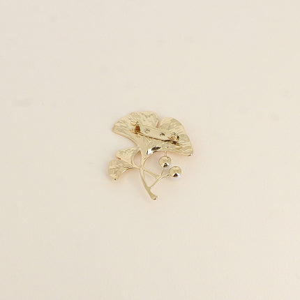 Avelia brooch - ginkgo motif with two white resin beads