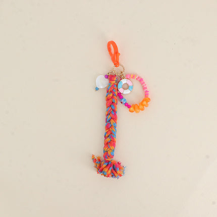 Handmade keychain - glazed ceramic donut, mother-of-pearl heart, beads and braided cord