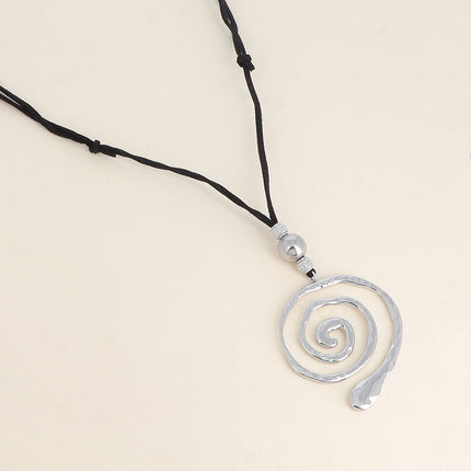 Sautoir sur cordon - pendentif spirale
