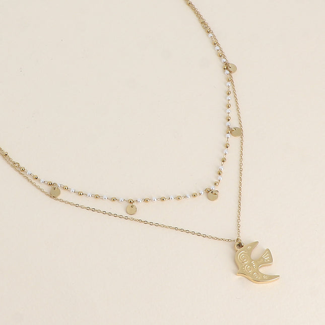 Two-strand necklace - bird-shaped pendant, white resin beads