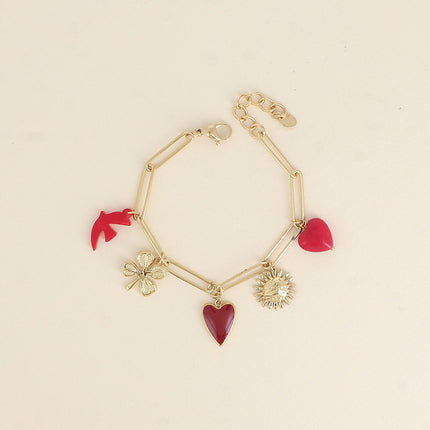 Bracelet - pendentifs (coeur martelé, oiseau en résine, coeur en émail, fleur, coeur en pierre naturelle)