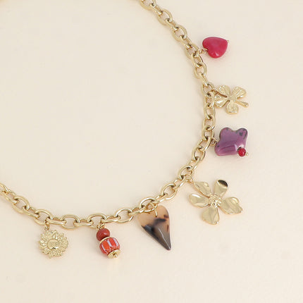 Collier - perles et oiseau en céramique, trèfle, coeur en résine léopard et fleur