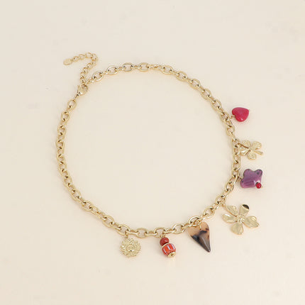 Collier - perles et oiseau en céramique, trèfle, coeur en résine léopard et fleur