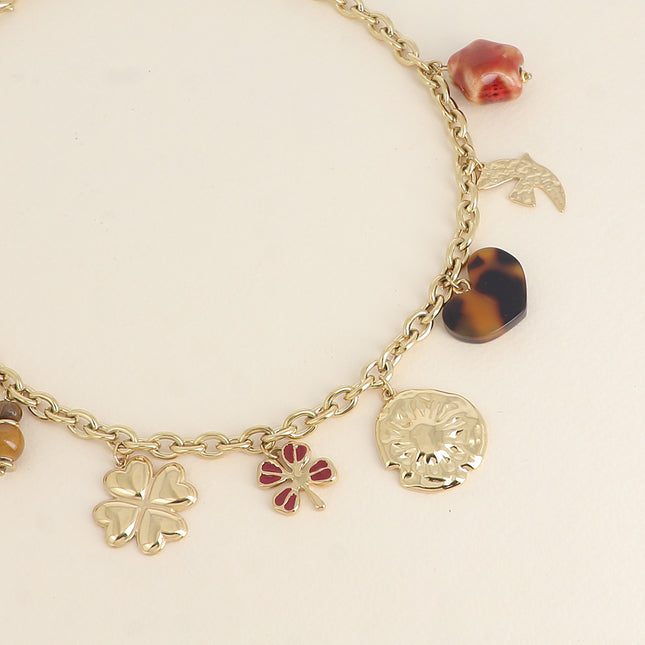 Necklace - clovers with enamel, sun, leopard resin heart, hammered bird, glazed ceramic star