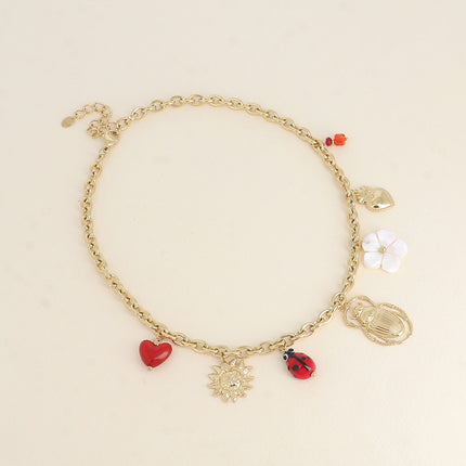 Collier - soleil, coccinelle en céramique émaillée, scarabée, fleur nacrée, coeurs