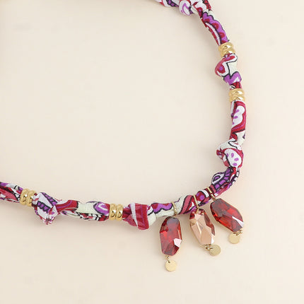 Collier sur tissu Tina - orné de 3 cristaux Swarovski®