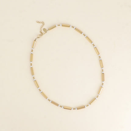 Collier sur fil - tubes en hématite et perles en résine blanche