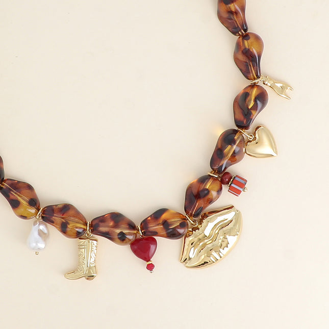 Necklace on a thread - resin beads and stainless steel tassels (boot, heart bead, mouth, glazed ceramic, heart)