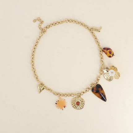 Collier Louis - coeur, soleil nacré, fleur martelée, coeur en résine, fleur, perle en résine, botte