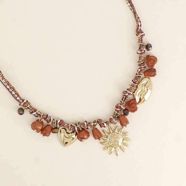 Collier sur cordon - perles fleurs et breloques en acier inoxydable (coeur, soleil et bouche)