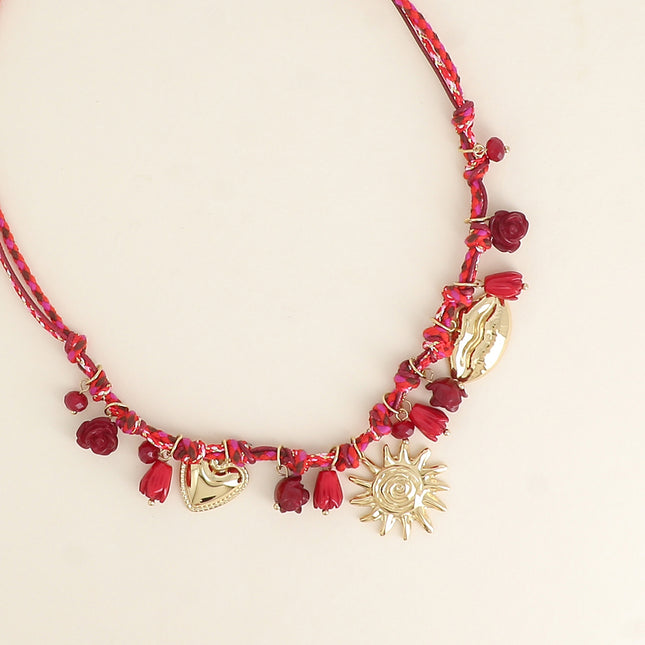 Collier sur cordon - perles fleurs et breloques en acier inoxydable (coeur, soleil et bouche)