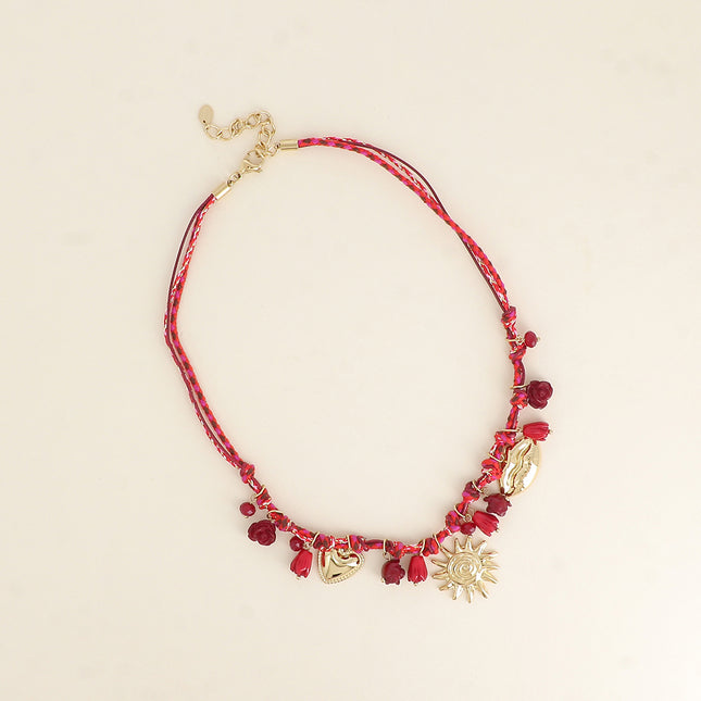 Collier sur cordon - perles fleurs et breloques en acier inoxydable (coeur, soleil et bouche)