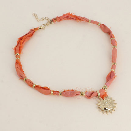 Collier en tissu Aquarela - motifs et pampille soleil souriant