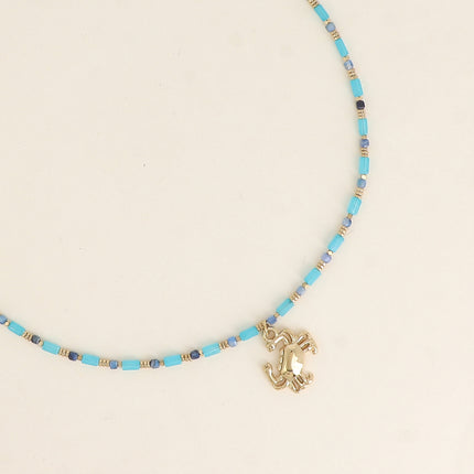 Collier Carlota - ras de cou, pierres naturelles et pendentif (crabe, lune, coeur, trèfle, fleur, soleil)