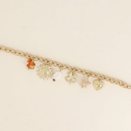 Bracelet - pendentifs (soleil, perle d'eau douce, trèfle, étoile en résine, coeur)