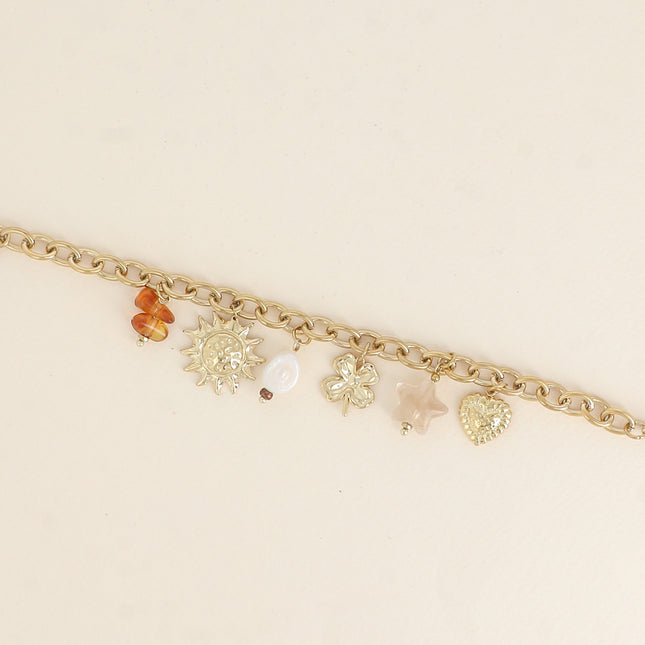 Bracelet - pendentifs (soleil, perle d'eau douce, trèfle, étoile en résine, coeur)