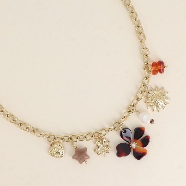 Collier - pendentifs (soleil, perle d'eau douce, trèfle, étoile et fleur en résine, coeur)