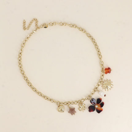 Collier - pendentifs (soleil, perle d'eau douce, trèfle, étoile et fleur en résine, coeur)