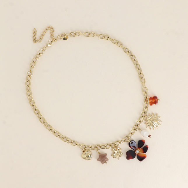 Collier - pendentifs (soleil, perle d'eau douce, trèfle, étoile et fleur en résine, coeur)