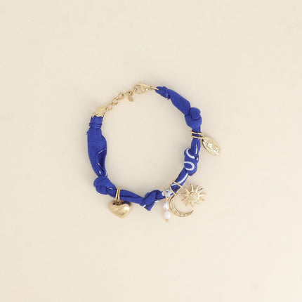 Bracelet - ruban, breloques (soleil, coeur, la Madone, perles d'eau douce, lune)