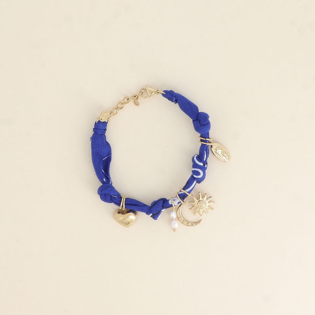 Bracelet - ruban, breloques (soleil, coeur, la Madone, perles d'eau douce, lune)