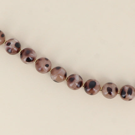 Bracelet on cable - leopard print resin ball beads