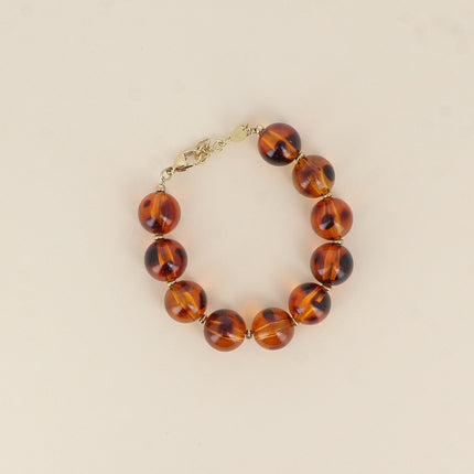Bracelet on cable - leopard print resin ball beads