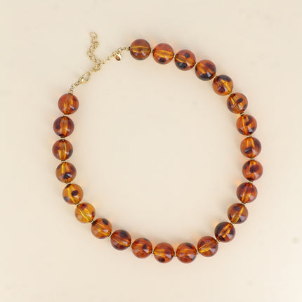 Collier sur câble - perles boules en résine léopard