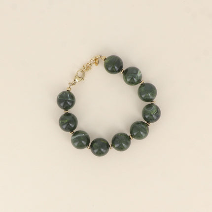 Bracelet sur câble - perles boules en résine