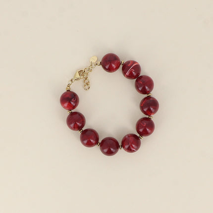 Bracelet sur câble - perles boules en résine